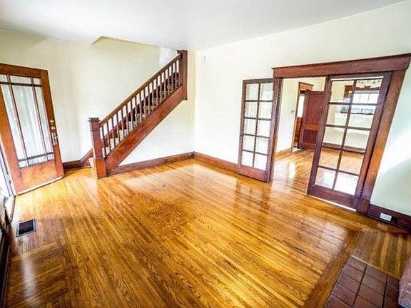 Front of Home: Living & Lounge Area / TV Room. Staircase lea