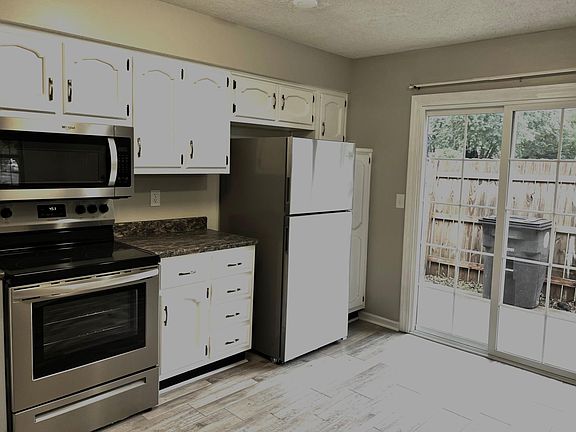 Kitchen opens to side patio