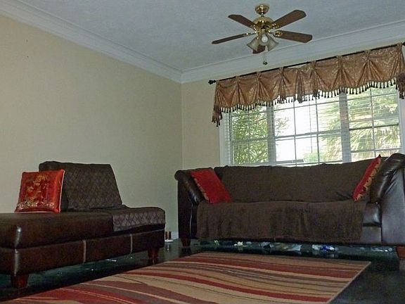 Den with large window.