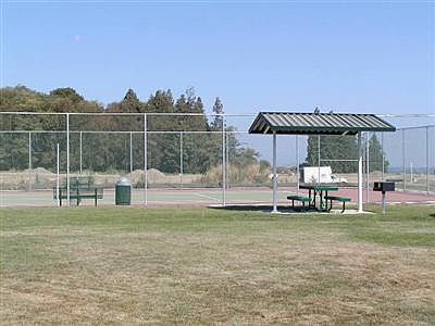 Tennis courts and picnic bench.