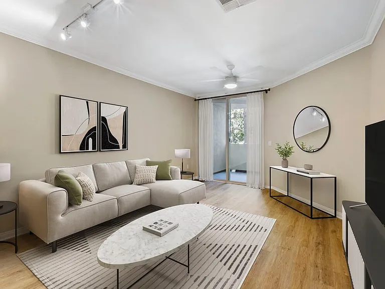Renovated Package I living room with hard surface flooring