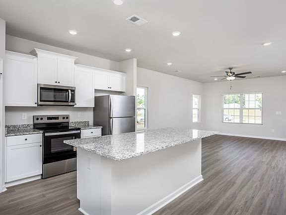 The kitchen opens to the family room and dining room.