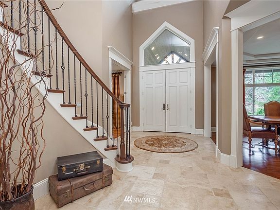 Gorgeous entry with beautiful millwork and tile floor