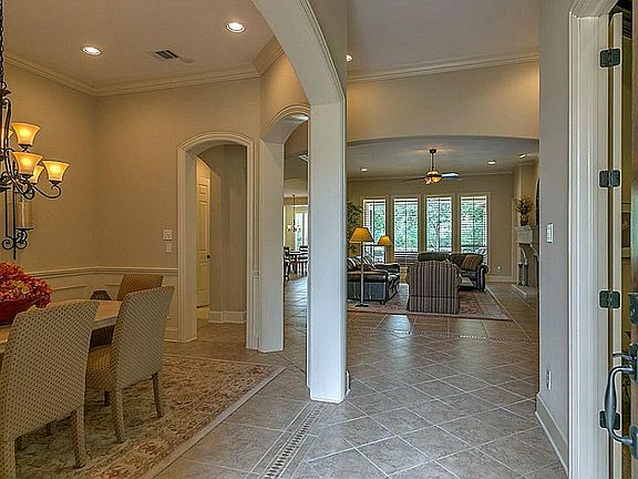 Walk into the home and you are greeted with high ceilings, 13x13 Tosca beige tile floors set on diag