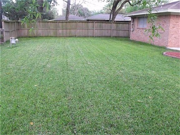 Huge, lush fenced back yard...with plenty of room for the children and/ or family pets.