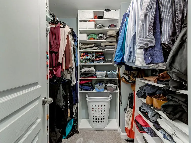 Large walk in closet in master bedroom.
