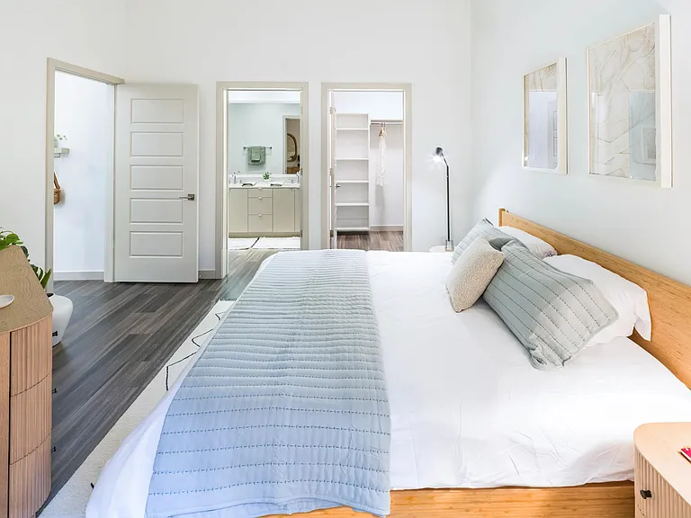 Spacious bedrooms with large closets, wood-style plank flooring, and 9-foot ceilings.