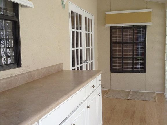 Sunroom has great storage cabinets