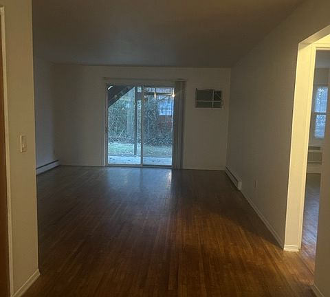Living room with double doors to first floor patio