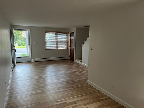 Looking through open concept dining / living toward open front door