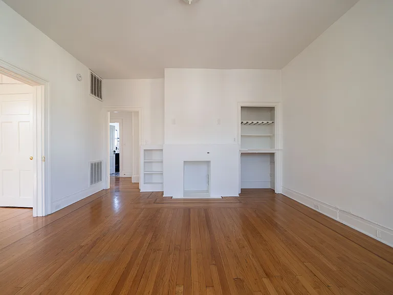 Living room with built in shelving and "fireplace" (not useable).