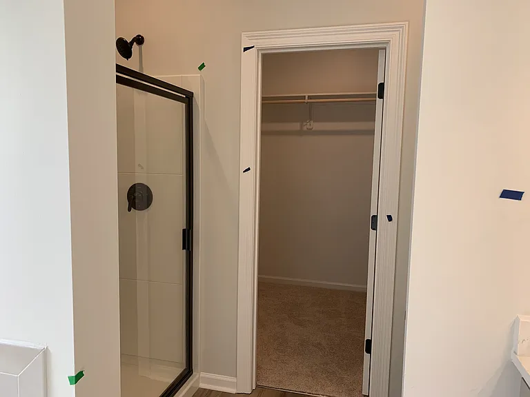 walk-in Master closet with his/her sides