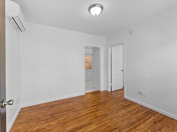 Looking from front door into the great room, PRIVATE HVAC, kitchen and bedroom entrance