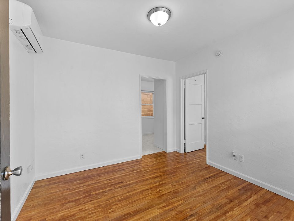 Looking from front door into the great room, PRIVATE HVAC, kitchen and bedroom entrance