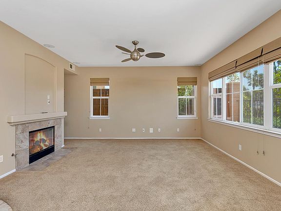 Family room with in ceiling surround sound speakers