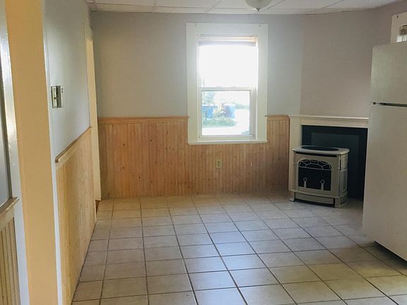 View of the other end of kitchen. looking from where washer/dryer hook up is.