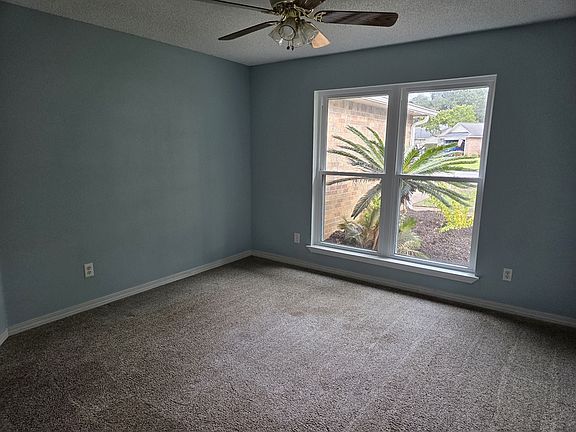 This area can be used as a formal dining area, den, home office, or homeschool location.