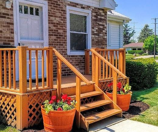 Recently installed walkway and front deck/porch.
