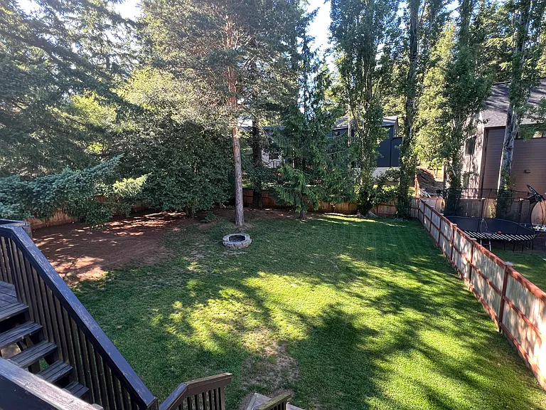 Fully fenced large and flat back yard.