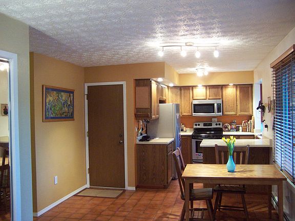 Open kitchen and dining room layout on real tile floor