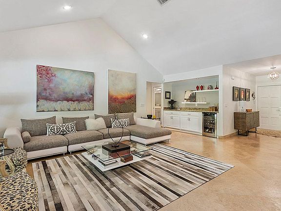 Great room includes wet bar and wine refrigerator.