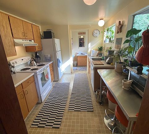 Kitchen, with bathroom beyond