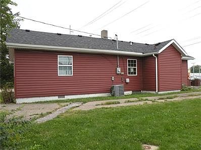 This is the north side of the building. One of the driveways off of Shadeland is on this side of the property and goes to the back where there are 4 spots of parking.