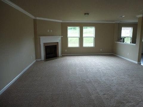 Spacious living with a wood burning fireplace