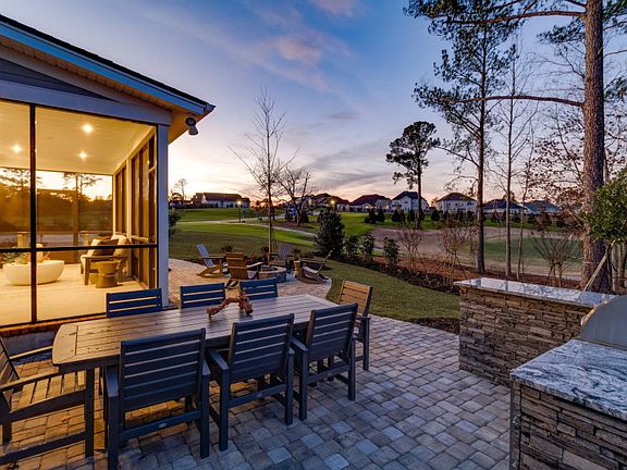 Spacious screened in porch and fire pit on the patio to gather and relax with friends
