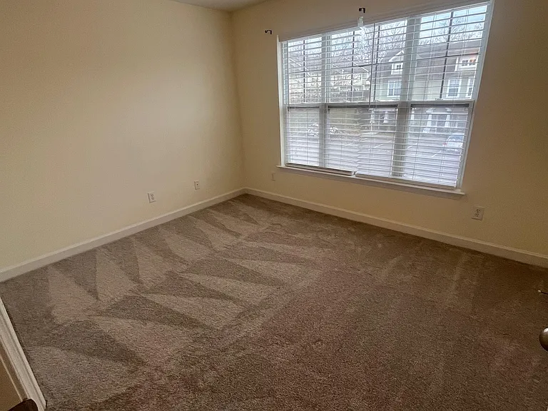 Guest bedroom with brand new carpet