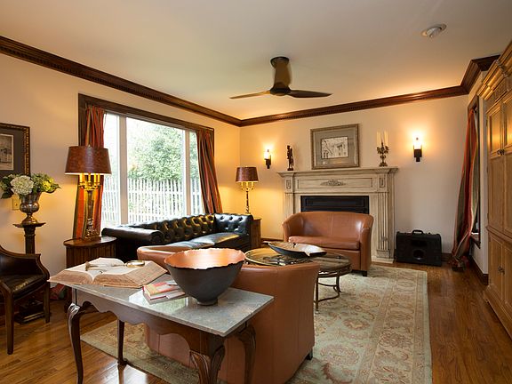 Opening living room has fireplace