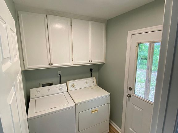 Laundry room with door to the back yard.