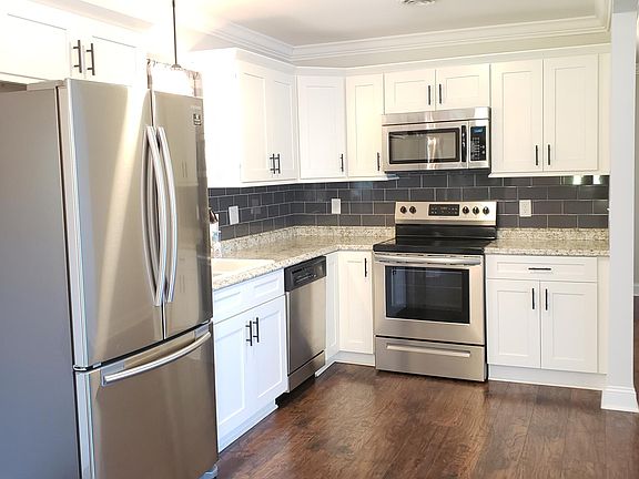 Updated kitchen with stainless steel appliances.