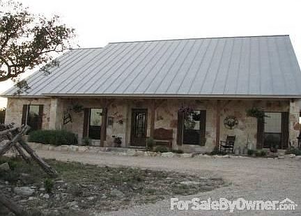 510 CR 243
						:
						All rock, 24 gauge standing seam roof, cedar accents