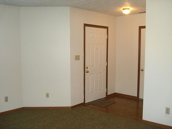 Foyer with hall closet and entrance to garage.