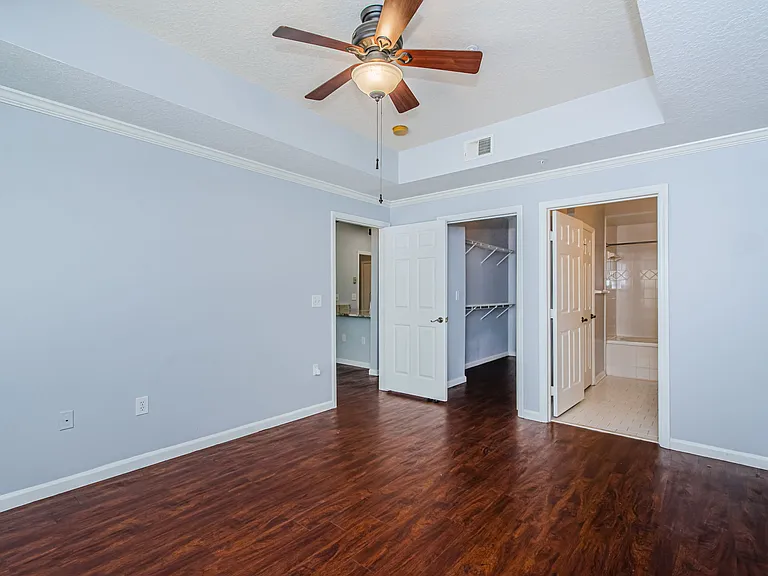 primary bedroom w/walk in closet and private bathroom entry