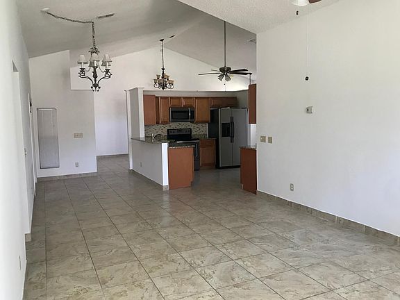 view of family room, kitchen, breakfast nook