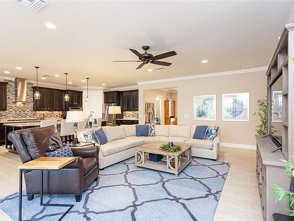 Popular Pinnacle floor plan with many upgrades including 8 ft. interior doors, crown molding, tile floors for easy care, custom 