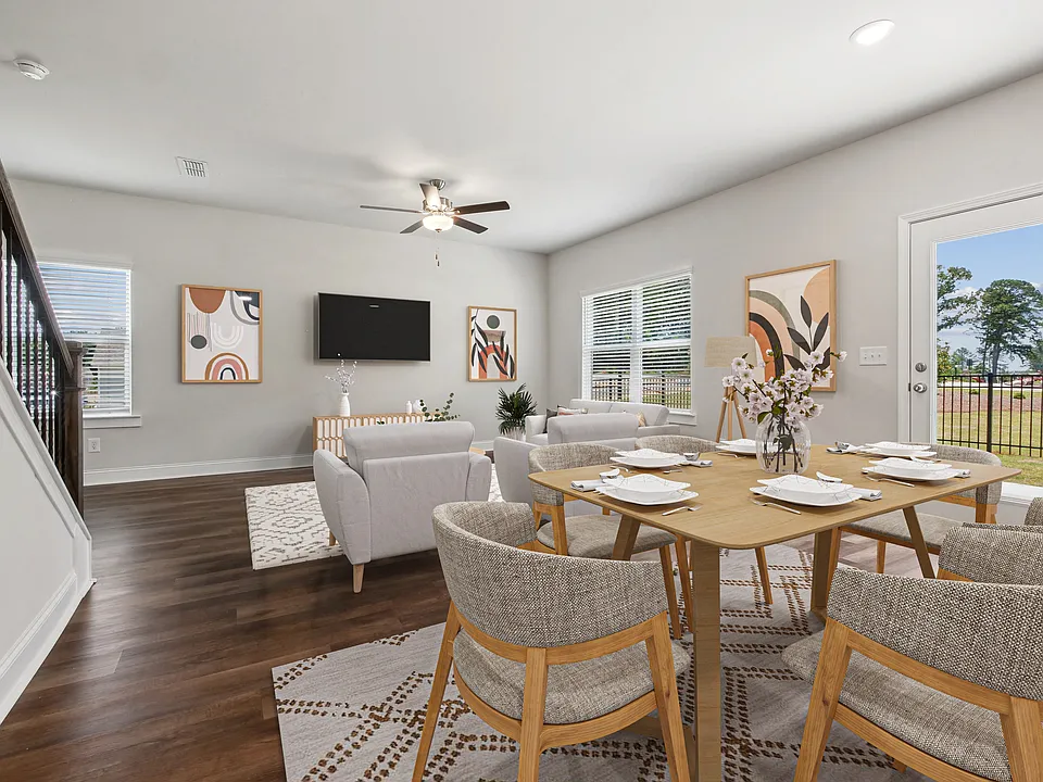 Living room with large window letting in a ton of natural light.