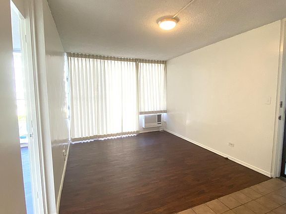 Living room w/ new drapes. Freidrich window AC