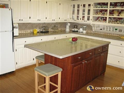 custom kitchen island.New stainless refigerator (not pictured)