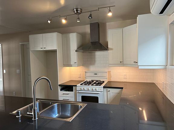 Beautiful contemporary kitchen with easy clean and attractive stone counters