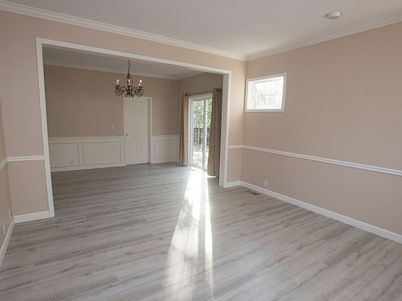 Living room and dining room with direct access to west side deck