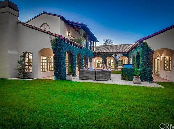 Mature landscaping encompasses this estate
