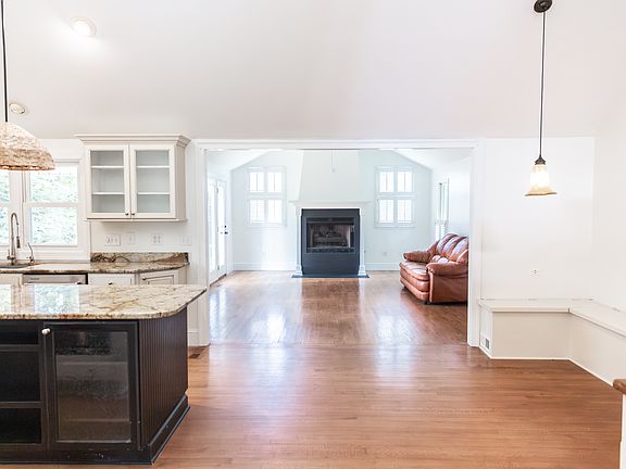 Kitchen is connected to the open living room which walks out onto the side deck.