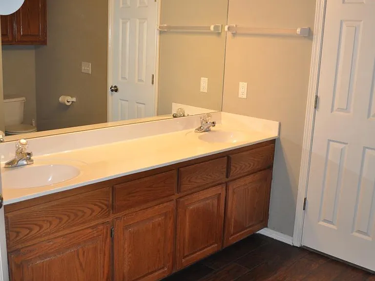 Master bath with double sinks, tub-shower and two separate closets