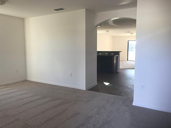 Living room looking into kitchen