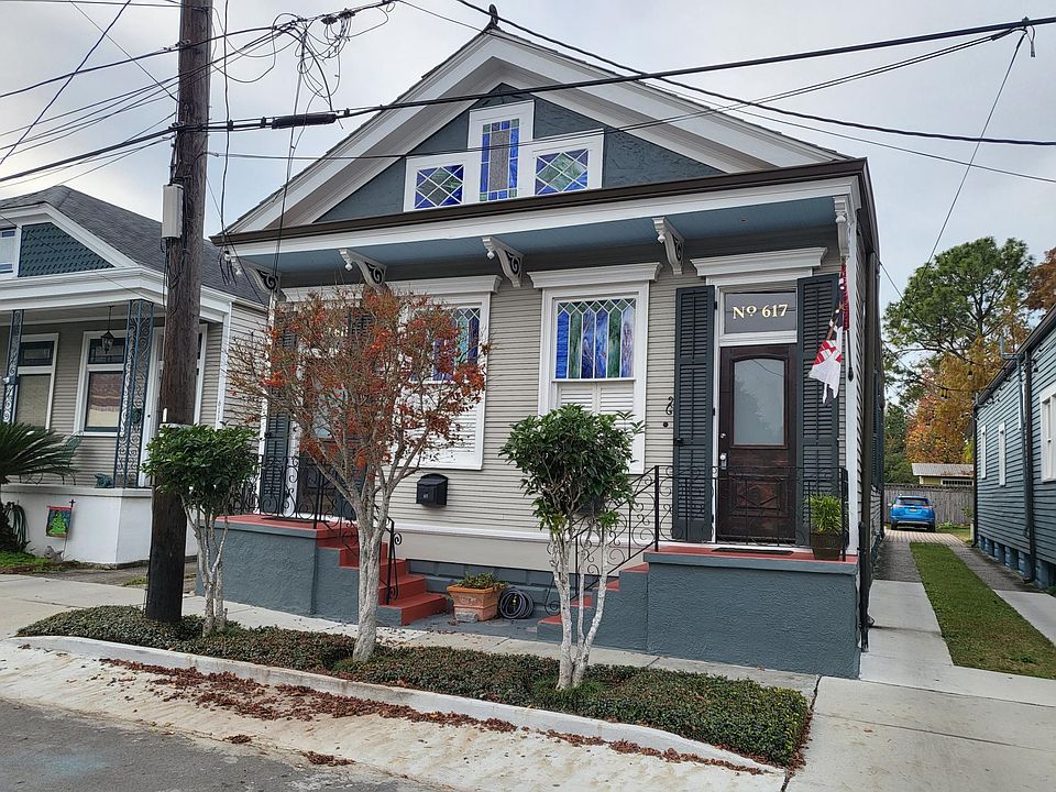 The home features many original elements including the doors, windows and stained glass.