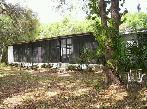 Exterior Back / Screened Pool Area