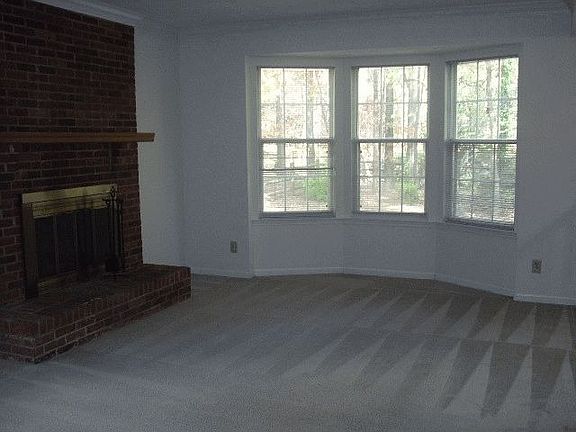 Den w/fireplace and bay windows